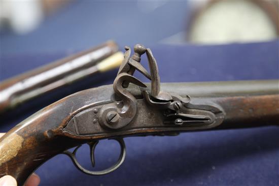 A pair of early 19th century flintlock holster pistols, signed Weston, Lewes, 15in.
